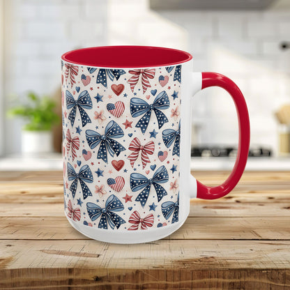 15oz ceramic mug with patriotic bows, hearts, and stars pattern; red interior and handle.