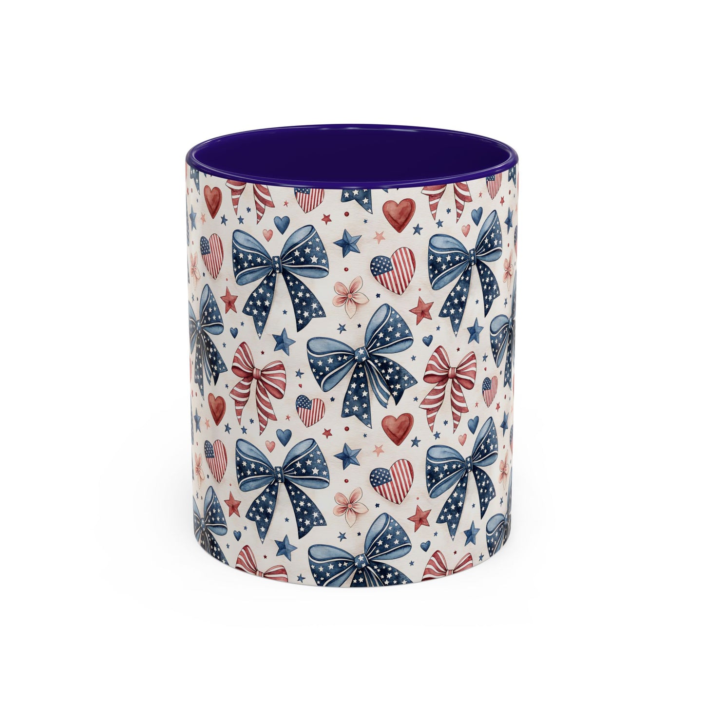 Ceramic mug with patriotic bows, hearts, and stars pattern; bold purple interior and handle.