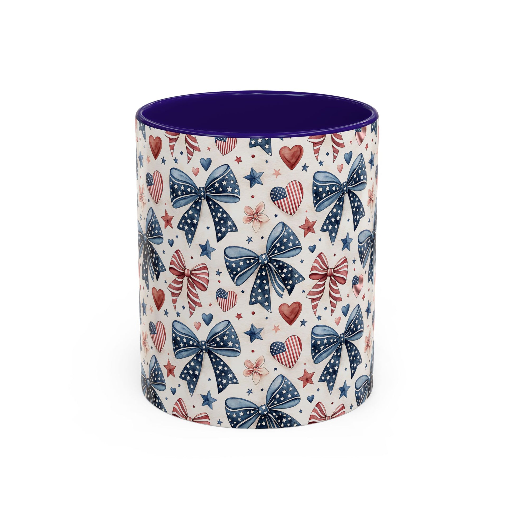 Ceramic mug with patriotic bows, hearts, and stars pattern; bold purple interior and handle.