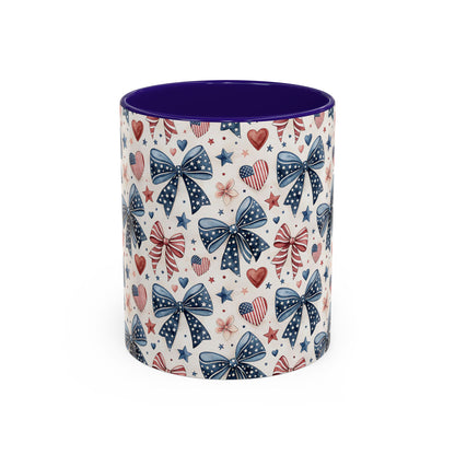 Ceramic mug with patriotic bows, hearts, and stars pattern; bold purple interior and handle.