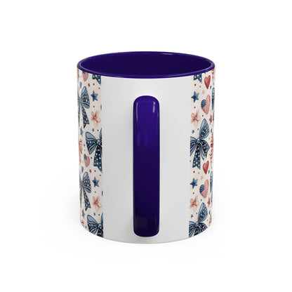 White ceramic mug with patriotic bows, hearts, and stars pattern, featuring a bold purple interior and handle.