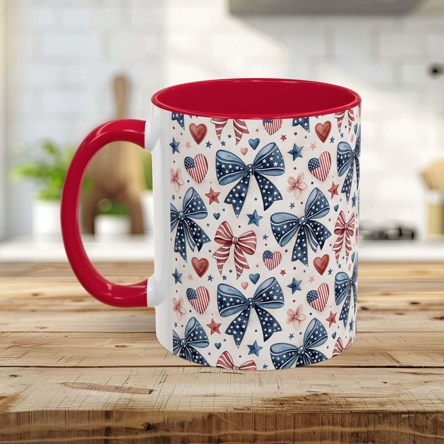 White ceramic mug with red interior and handle, featuring a patriotic bow, heart, and star pattern.