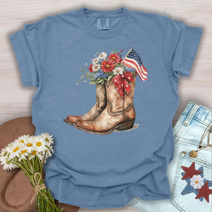 Blue Jean S t-shirt with watercolor cowboy boots, flowers, American flag, and star ribbon.