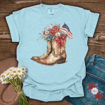 Chambray t-shirt with watercolor cowboy boots, patriotic flowers, and an American flag.