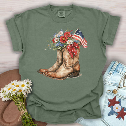 Moss S t-shirt with watercolor cowboy boots, flowers, American flag, and star ribbon.