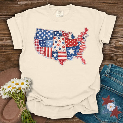 Ivory S t-shirt with a printed faux patchwork map of America, featuring stars, stripes, and floral patterns.