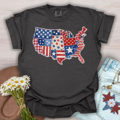 Pepper S t-shirt with a printed faux patchwork USA map in patriotic red, white, and blue patterns.