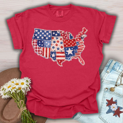 Red S-size t-shirt with a printed faux patchwork map of America, featuring stars, stripes, and floral patterns.