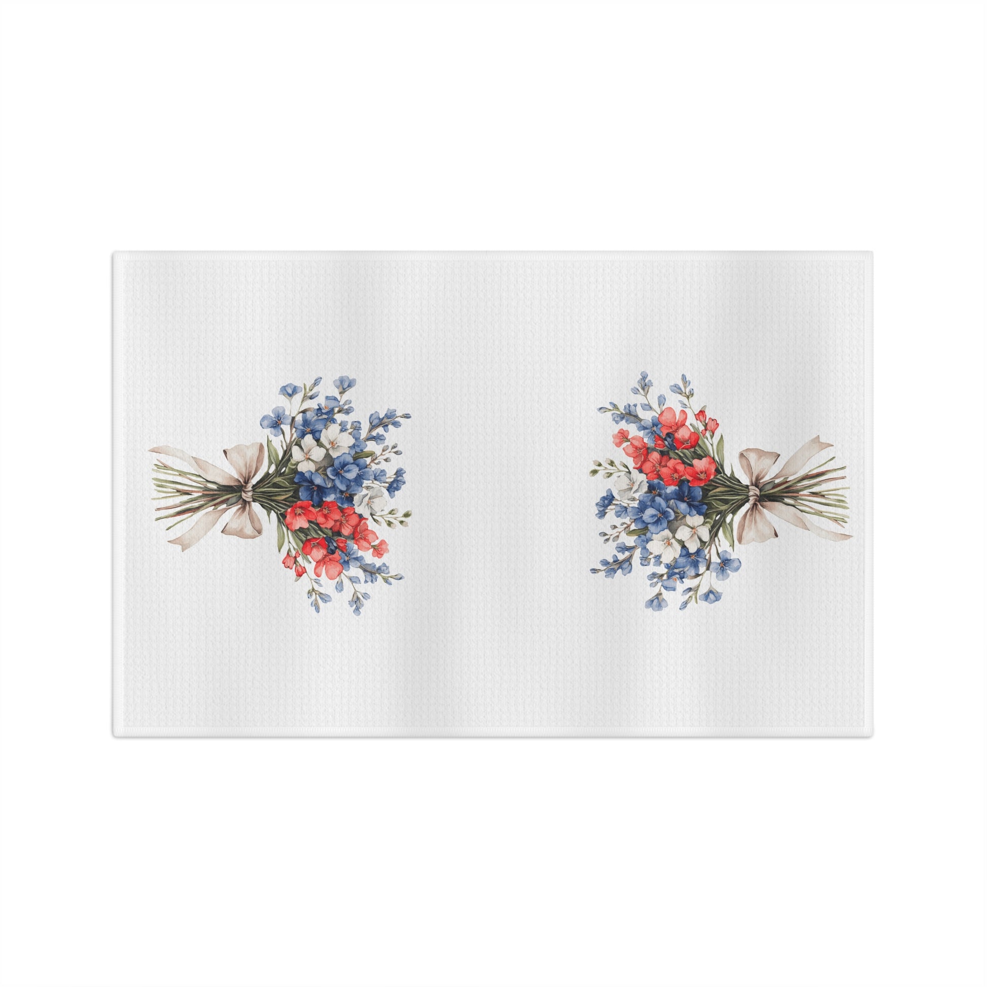 White microfiber tea towel with two vintage-style bouquets of red and blue flowers tied with twine.