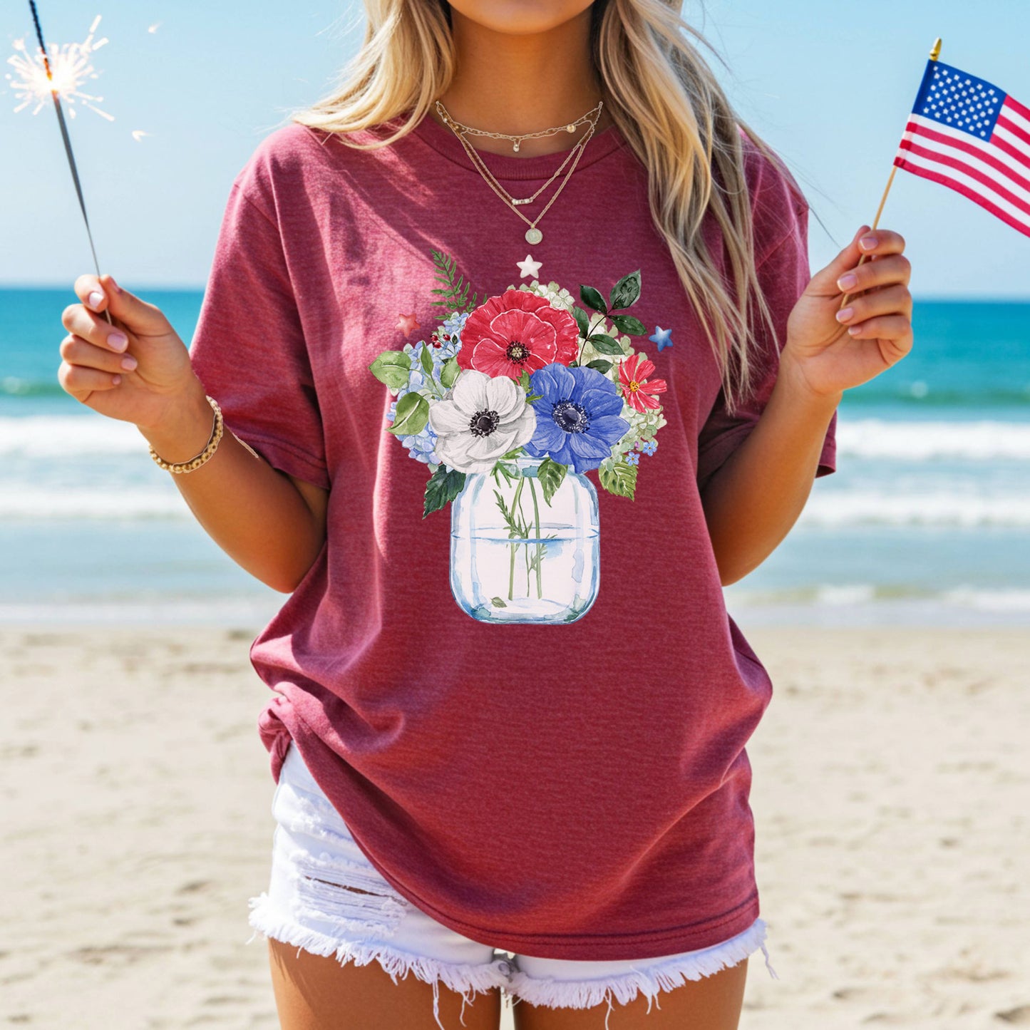 Red t-shirt with a patriotic floral bouquet in a mason jar, featuring red, white, and blue anemones and stars.