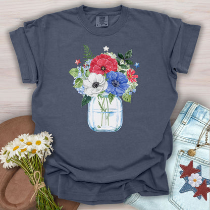Denim S t-shirt with a watercolor patriotic floral bouquet in a mason jar, featuring red, white, and blue anemones and stars.