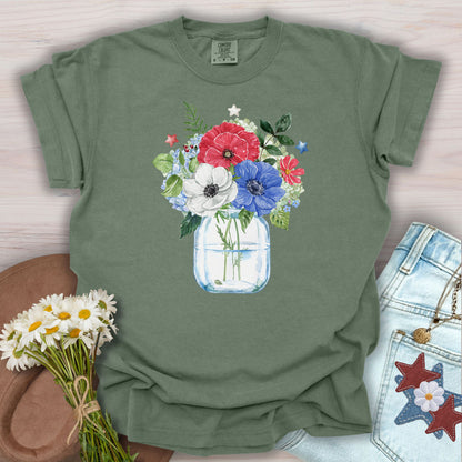 Moss S t-shirt with a patriotic red, white, and blue floral bouquet in a mason jar with stars.
