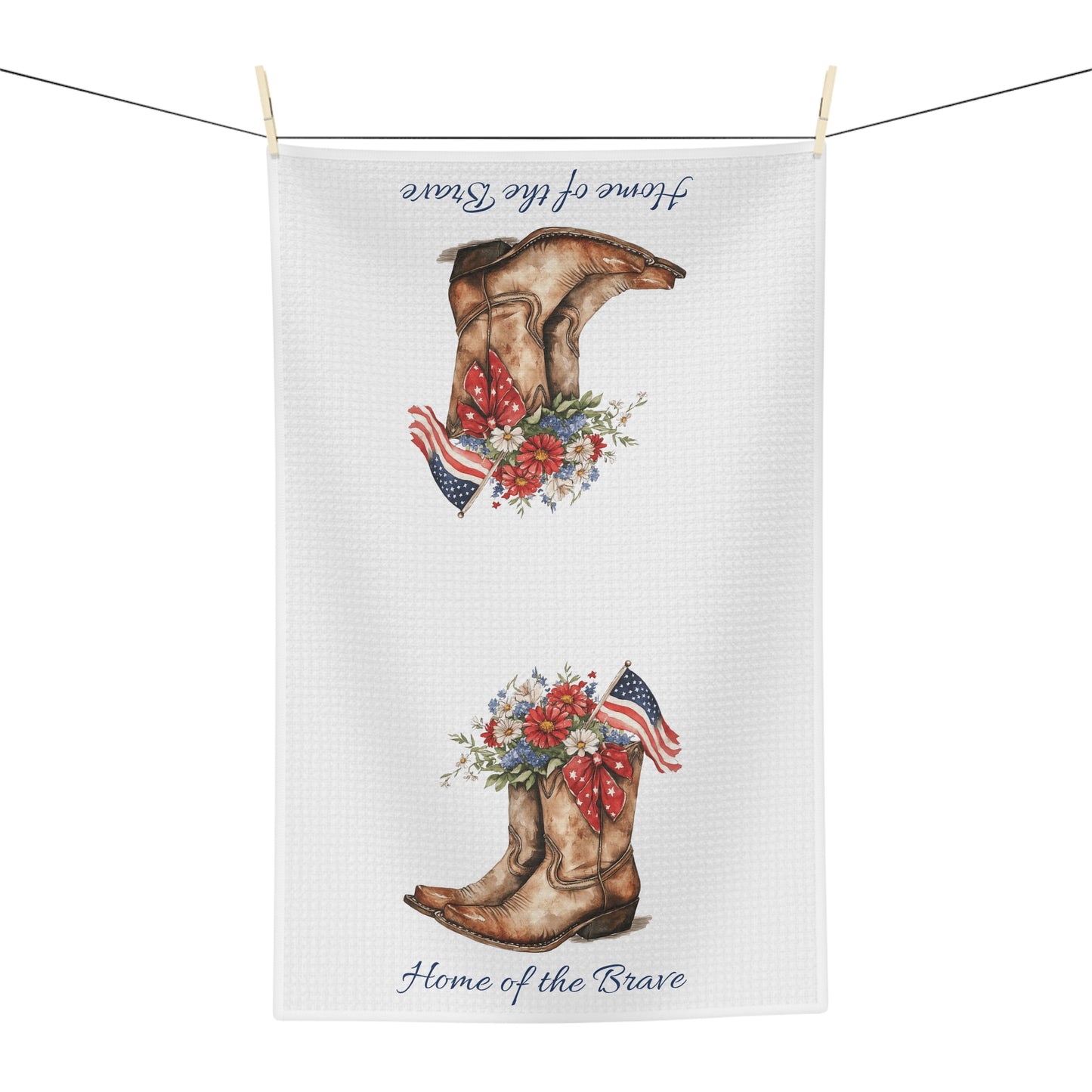 White microfiber tea towel with patriotic cowboy boots, wildflowers, and "Home of the Brave" text.