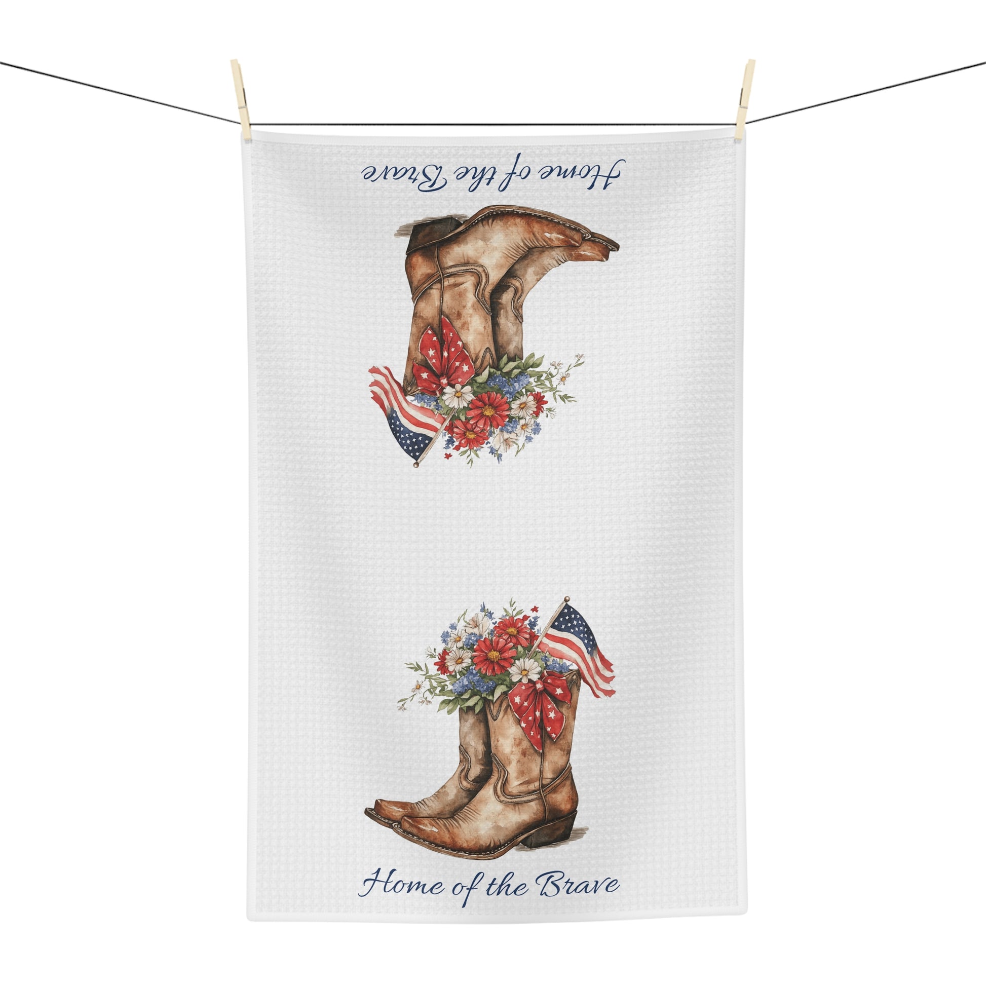 White microfiber tea towel with patriotic cowboy boots, wildflowers, and "Home of the Brave" text.