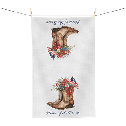 White microfiber tea towel with patriotic cowboy boots, wildflowers, and "Home of the Brave" text.