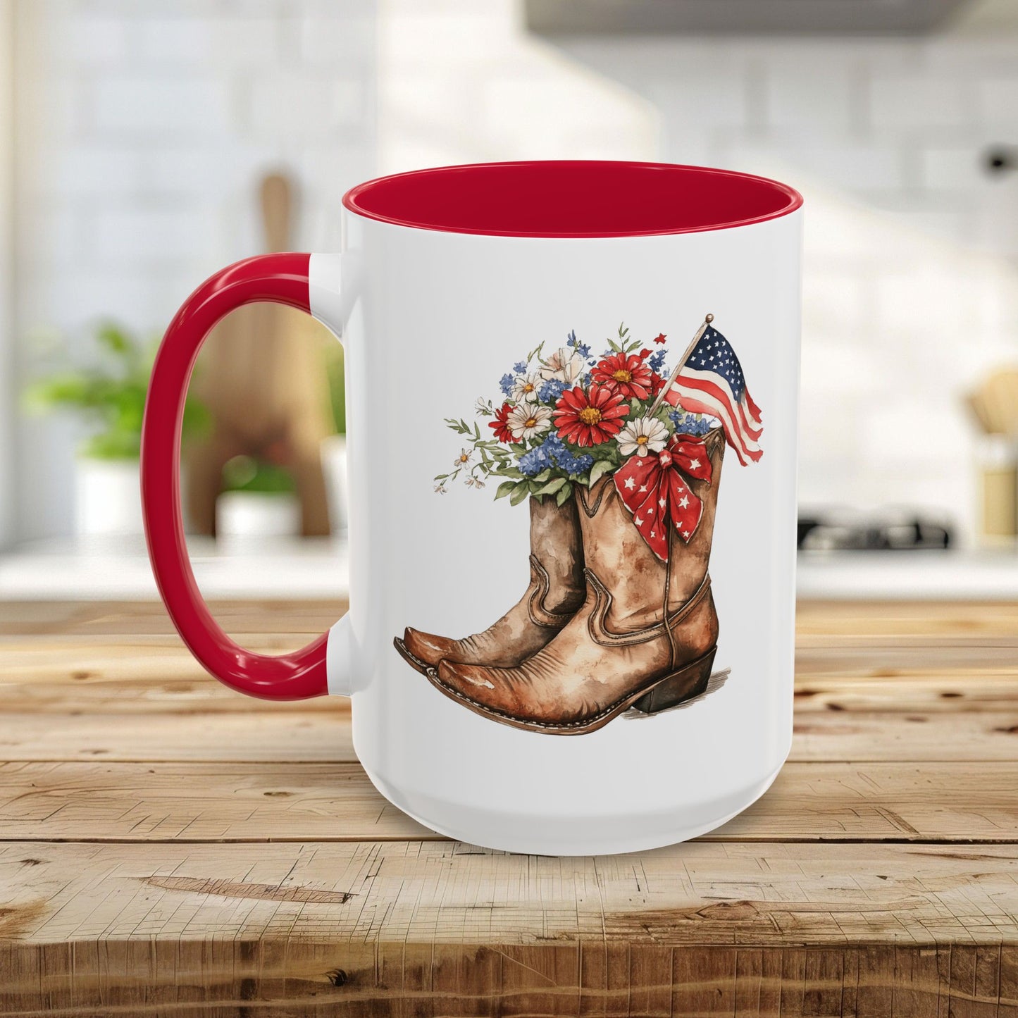 White ceramic mug with red handle and interior, featuring watercolor cowboy boots, wildflowers, and an American flag.