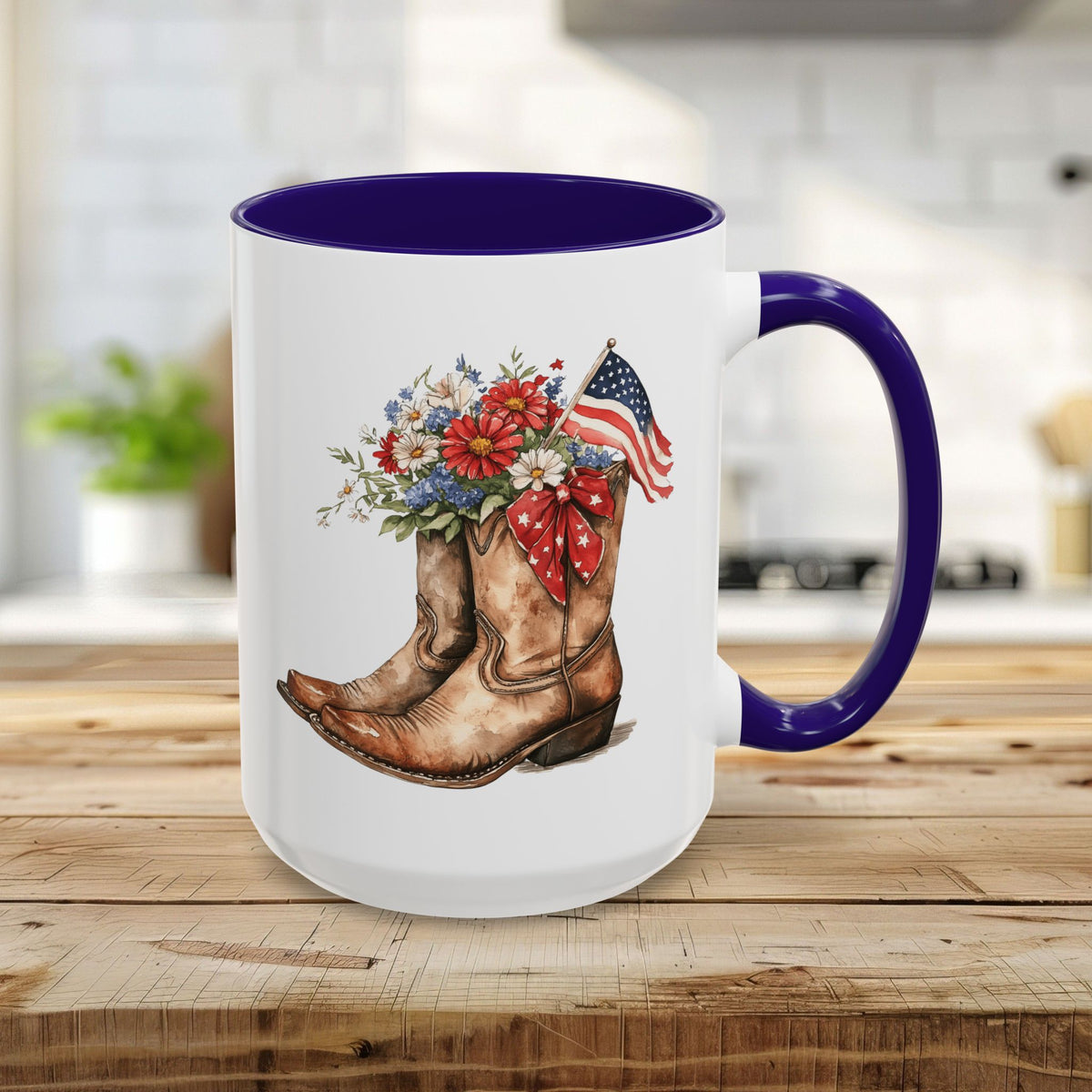 15oz ceramic mug with blue handle/interior, featuring watercolor cowboy boots, wildflowers, and an American flag.