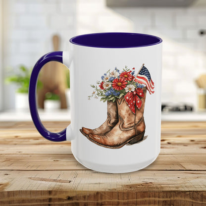 White ceramic mug with purple handle and interior, featuring watercolor cowboy boots, wildflowers, and an American flag.
