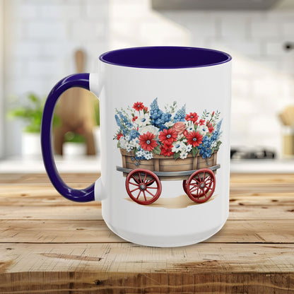 White ceramic mug with purple handle and interior, featuring a vintage wagon overflowing with red, white, and blue florals.