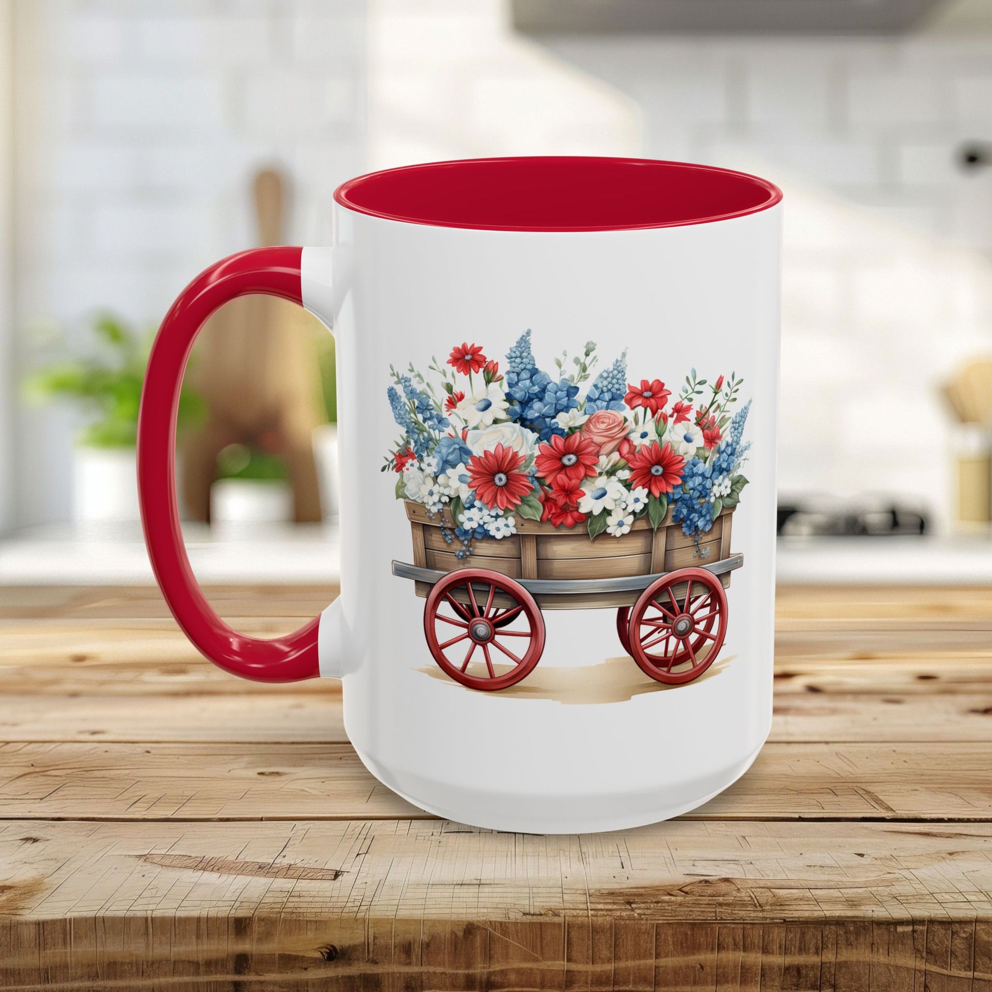White ceramic mug with red handle and interior, featuring a vintage wagon overflowing with red, white, and blue florals.