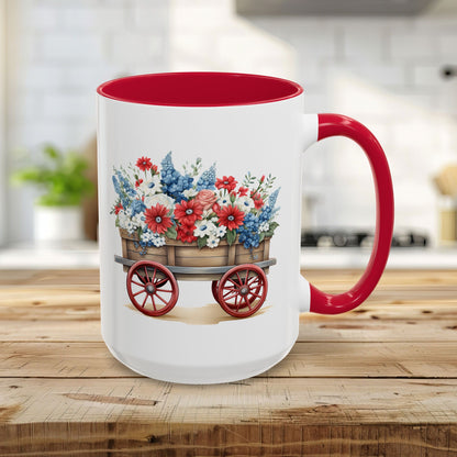 15oz ceramic mug with red handle and interior, featuring a vintage wagon overflowing with red, white, and blue florals.
