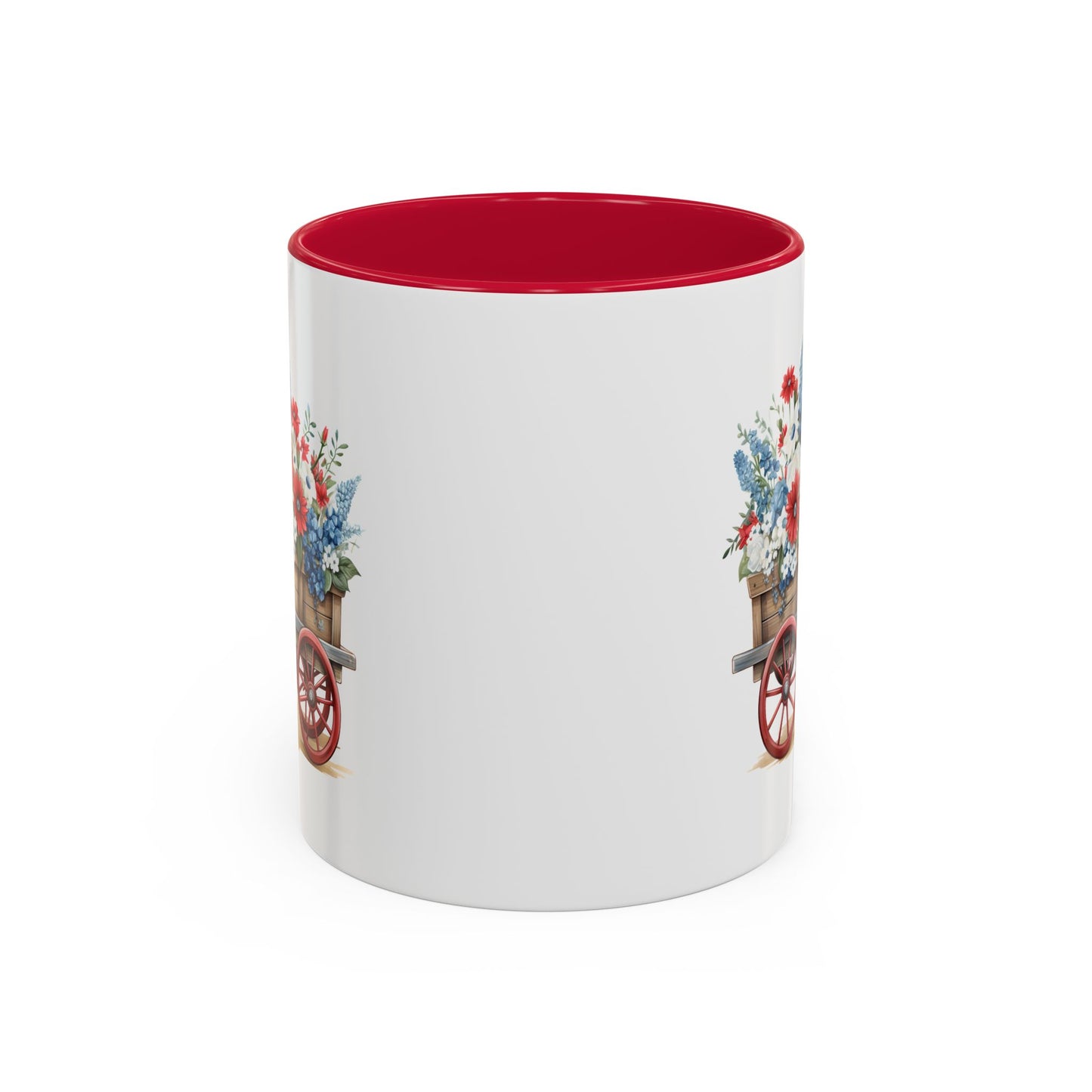 White ceramic mug with red interior and handle, featuring a vintage wagon overflowing with red, white, and blue florals.