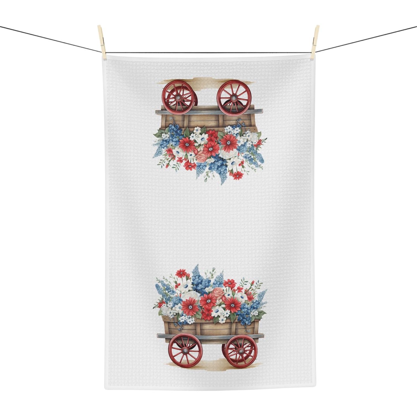 White microfiber tea towel with a vintage-inspired patriotic floral gardening wagon design, hanging on a clothesline.