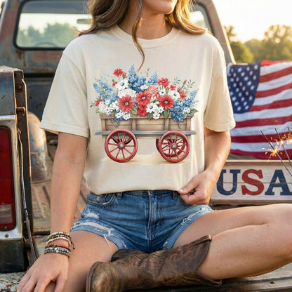 Relaxed-fit, garment-dyed patriotic flower wagon t-shirt in natural with red, white, and blue florals.