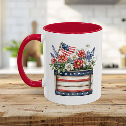 White ceramic mug with red interior and handle, featuring a patriotic garden box with daisies, lavender, and a US flag.