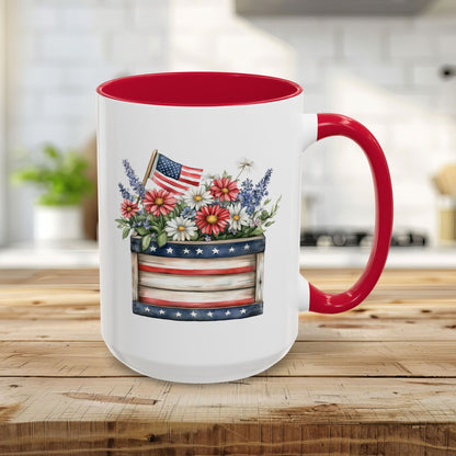 15oz ceramic mug with red interior/handle, featuring a patriotic garden box of daisies, lavender, and US flag.