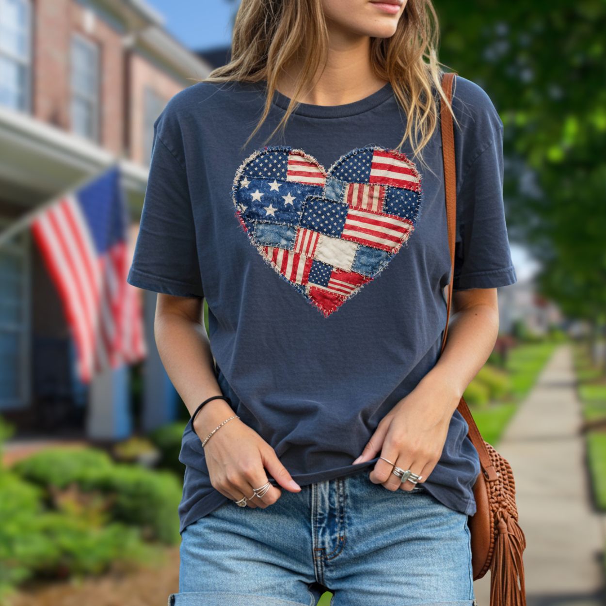 Navy t-shirt with a printed patchwork heart of distressed American flag designs.
