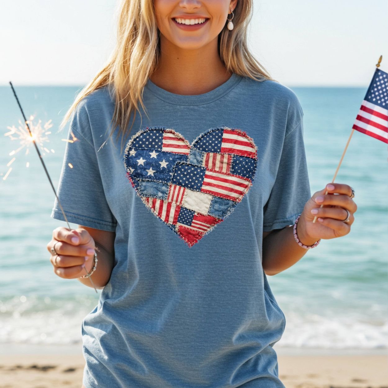 Garment-dyed blue t-shirt with a printed patchwork American flag heart design.