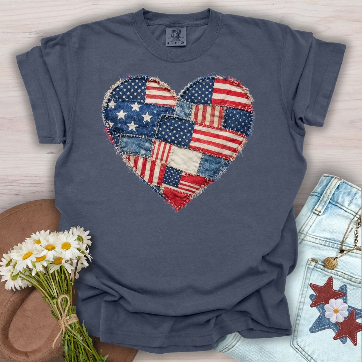 Denim S t-shirt with a printed patriotic faux quilt heart of distressed American flag patches.