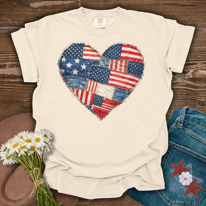 Ivory S t-shirt with a printed faux quilt heart of distressed American flag patches and frayed edges.
