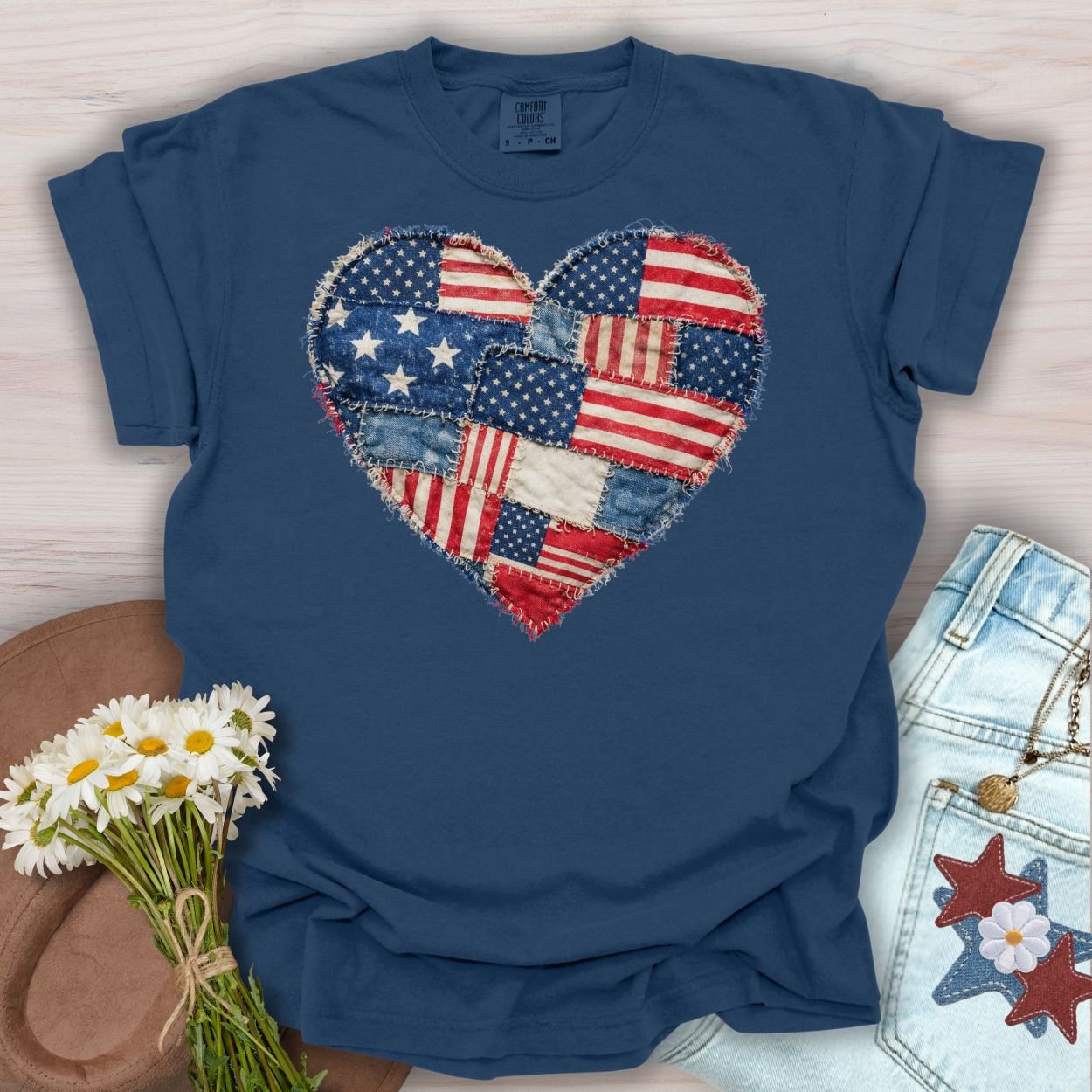 True Navy S t-shirt with a printed distressed faux quilt heart of American flag patches.