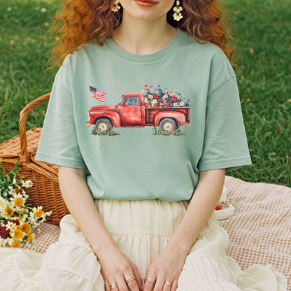Garment-dyed sage green t-shirt with a watercolor red pickup truck, wildflowers, and an American flag.