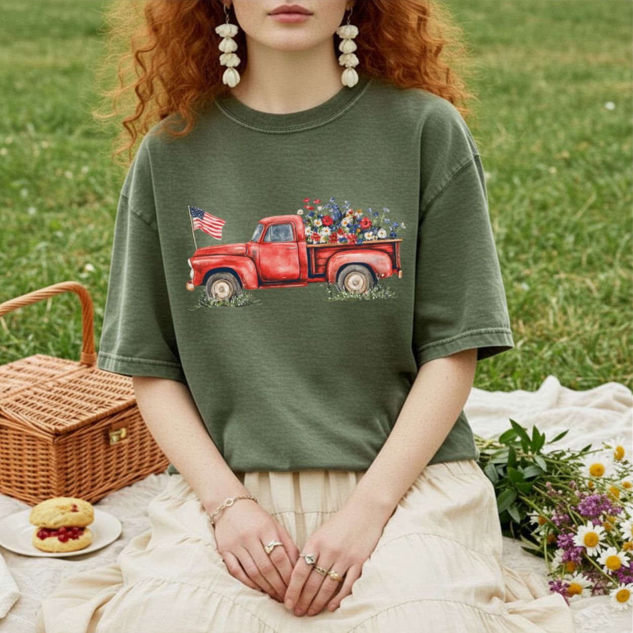 Garment-dyed olive green t-shirt with a vintage red pickup truck, wildflowers, and an American flag graphic.