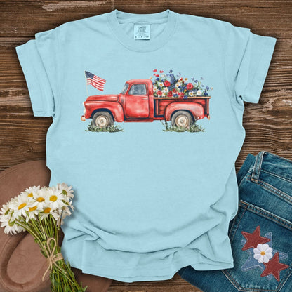 Chambray S t-shirt with a watercolor red pickup truck, wildflowers, and an American flag.