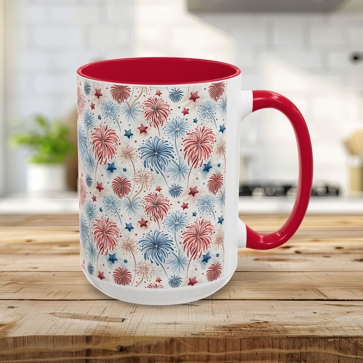 15oz white ceramic mug with red interior/handle and watercolor red/blue fireworks pattern.