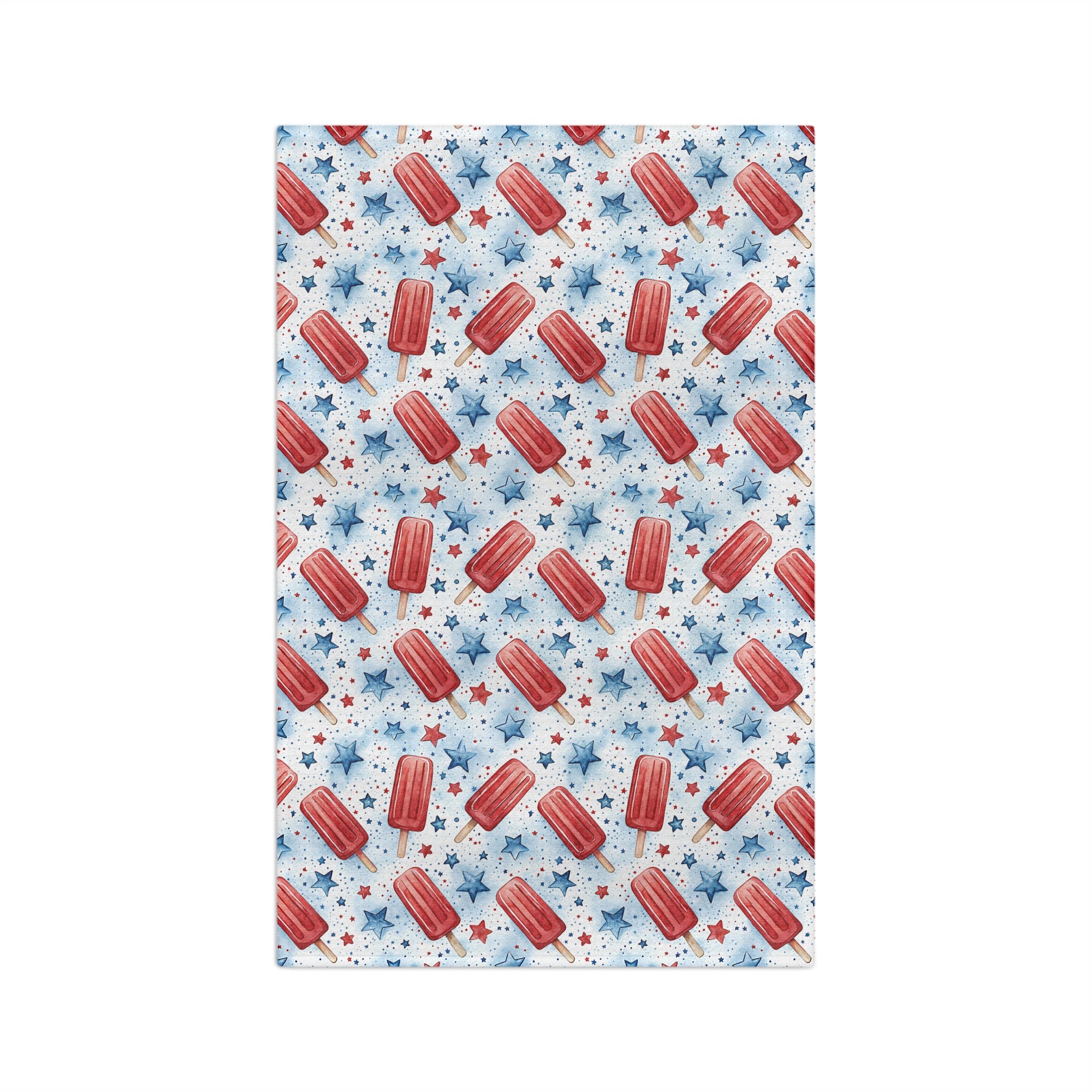 Microfiber tea towel with red popsicles and blue stars on a white background.