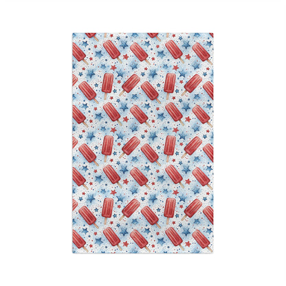 Microfiber tea towel with red popsicles and blue stars on a white background.