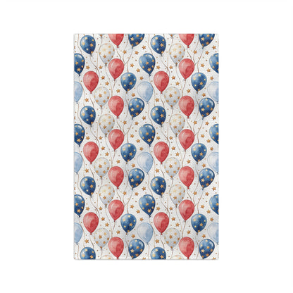 Microfiber tea towel with red, blue, and white balloons, gold stars, and hemmed edges.