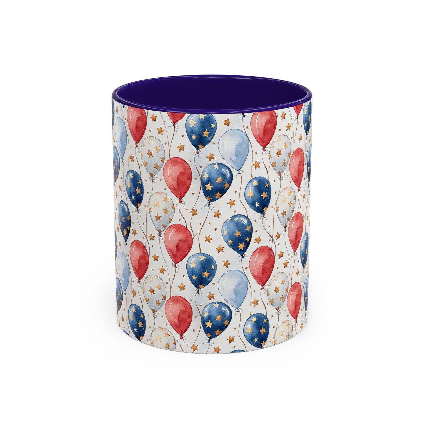 White ceramic mug with watercolor red, white, and blue balloons, gold stars, and a navy interior.