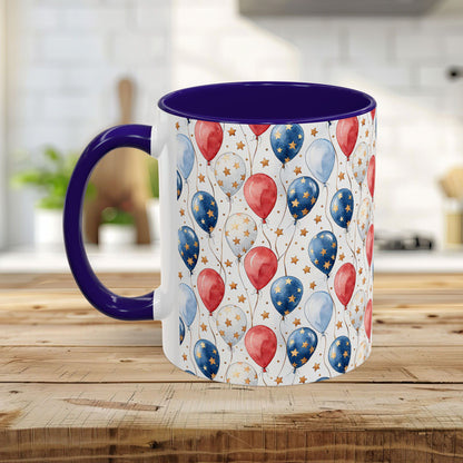 White ceramic mug with a purple handle and interior, featuring a watercolor red, white, and blue balloon print.