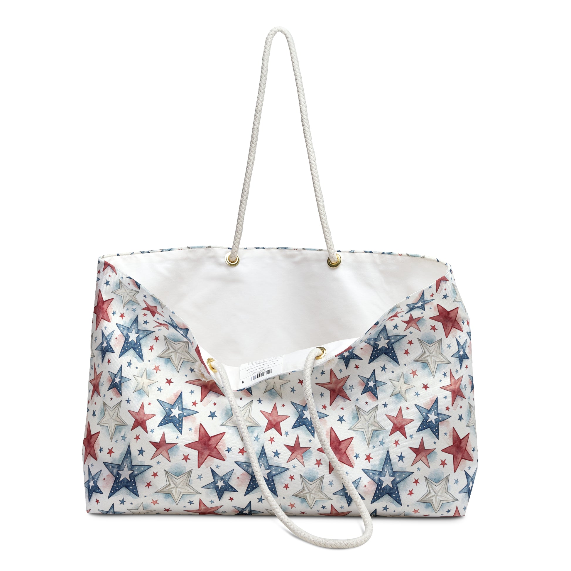 Patriotic red, white, and blue stars weekender bag with cream rope handles and T-bottom.