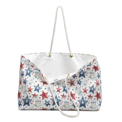 Patriotic red, white, and blue stars weekender bag with cream rope handles and T-bottom.