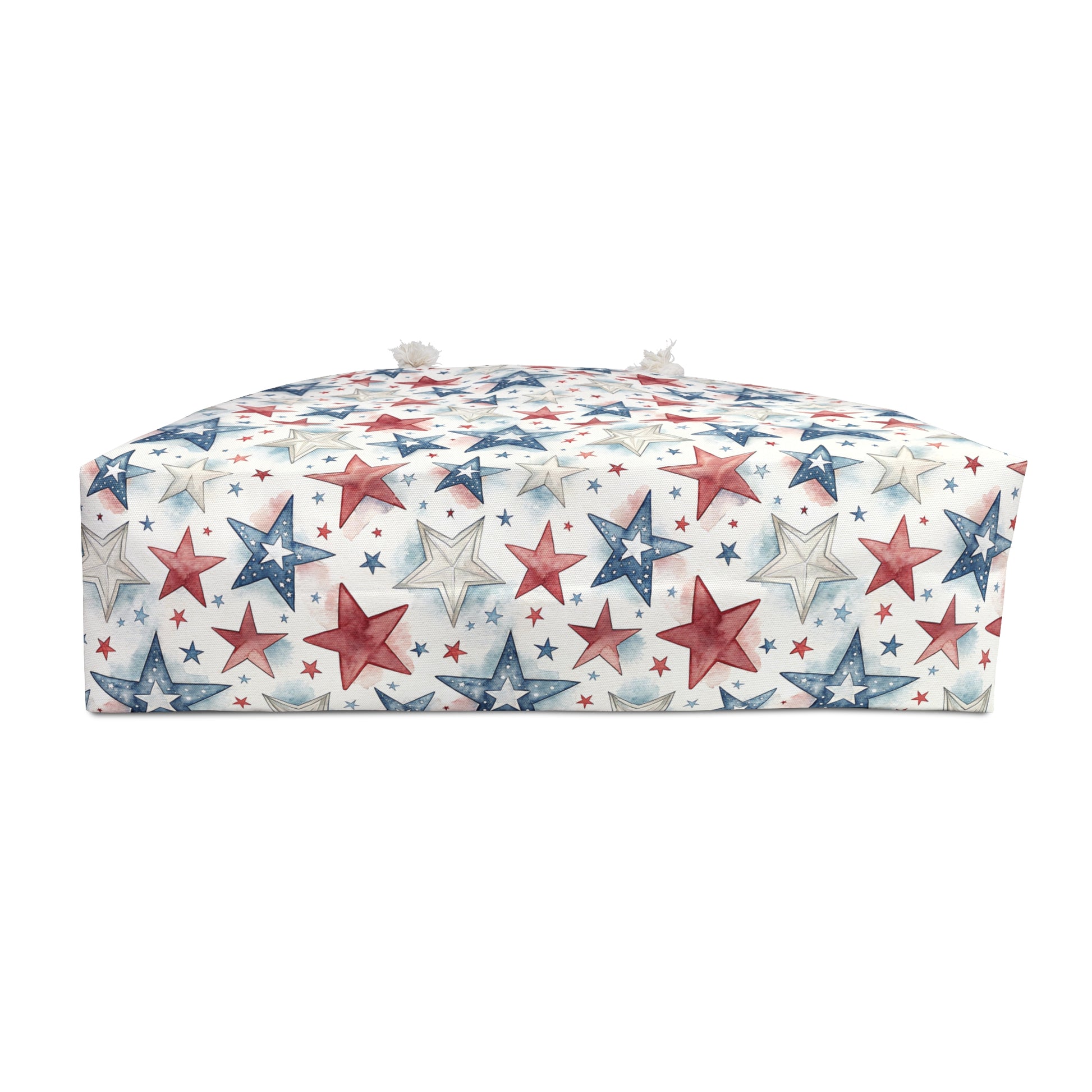 Red, white, and blue star-patterned spun polyester weekender bag with cream rope handles.
