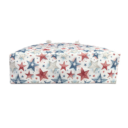 Red, white, and blue star-patterned spun polyester weekender bag with cream rope handles.