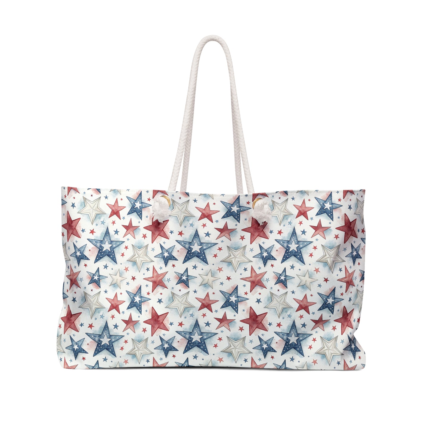 Spacious red, white, and blue star-patterned spun polyester weekender bag with cream rope handles.