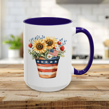 15oz ceramic mug with a patriotic sunflower bouquet in an Americana-striped pot, blue interior and handle.
